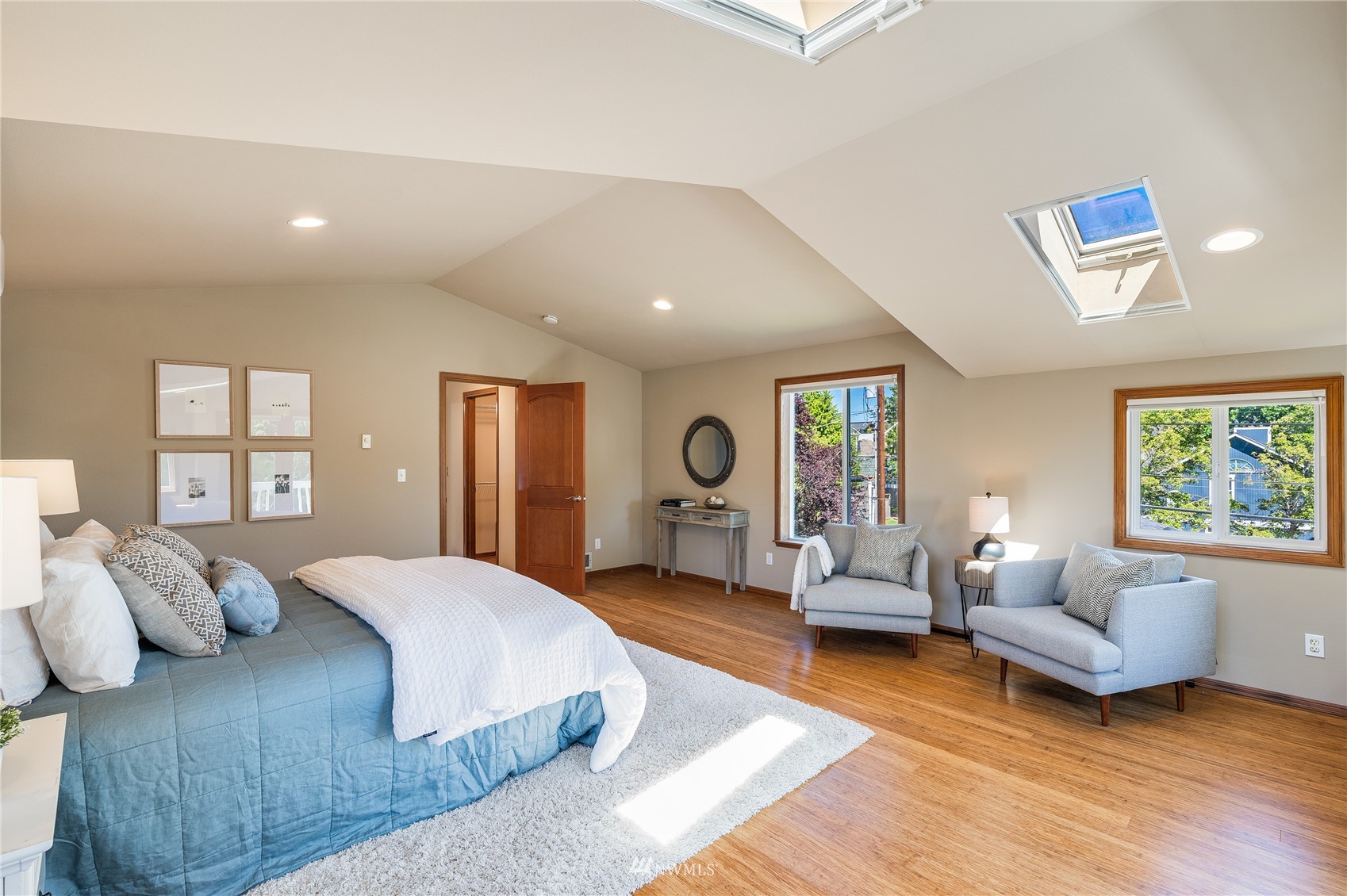 548 North 75th Street Seattle, WA 98103 - Photo 5 of 39 a spacious bedroom with a balcony a bed and a couch