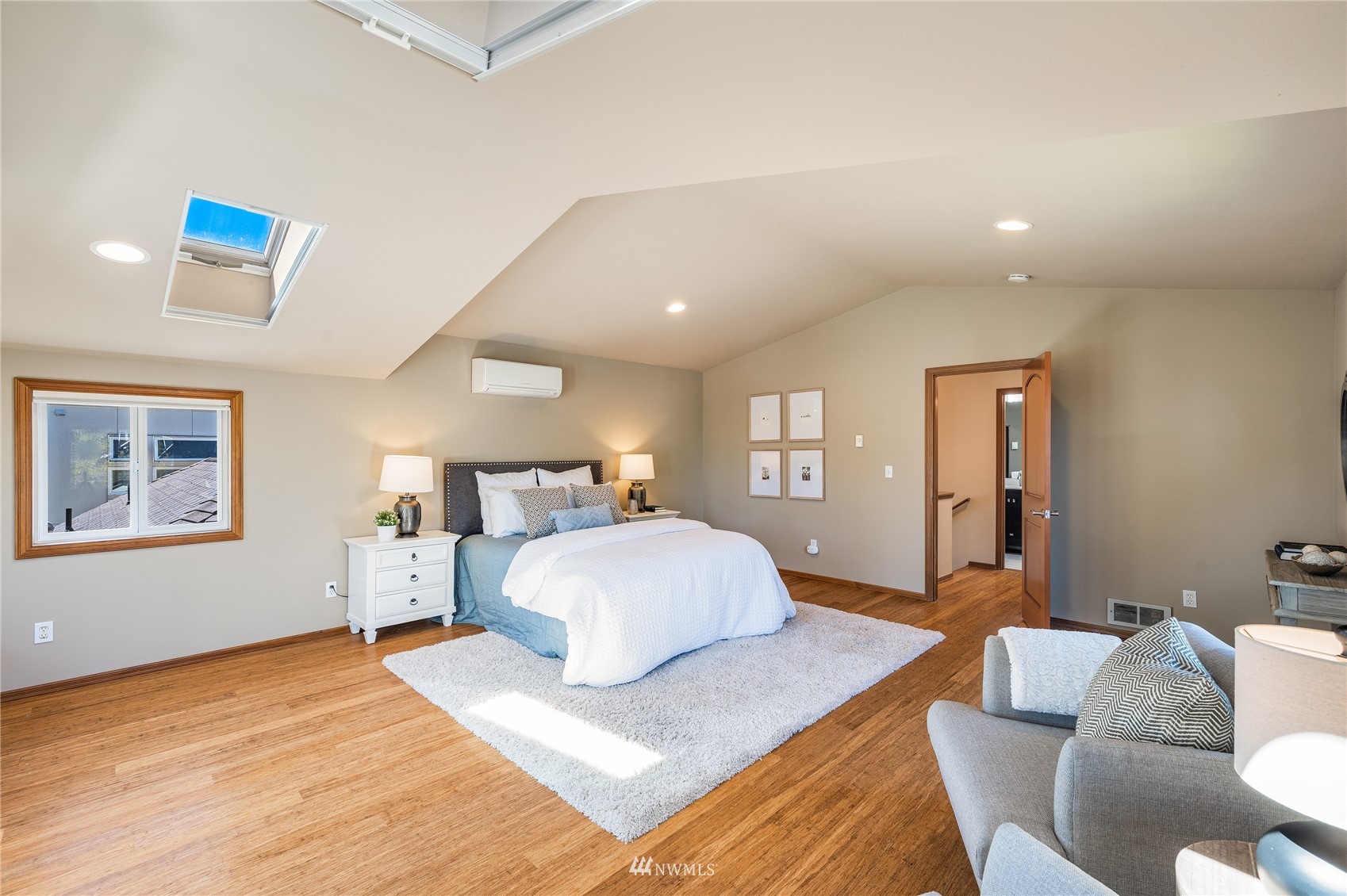 548 North 75th Street Seattle, WA 98103 - Photo 6 of 39 a bedroom with a bed and wooden floor