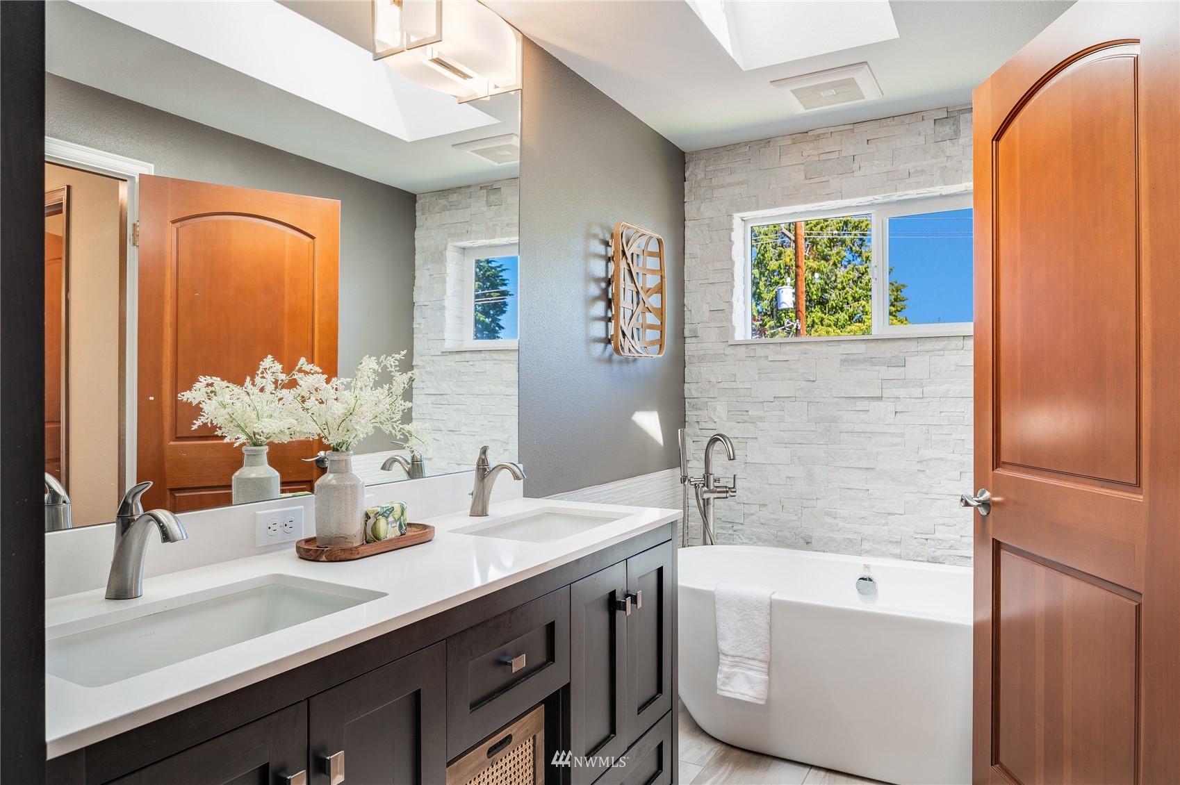 548 North 75th Street Seattle, WA 98103 - Photo 7 of 39 a bathroom with a tub sink and mirror