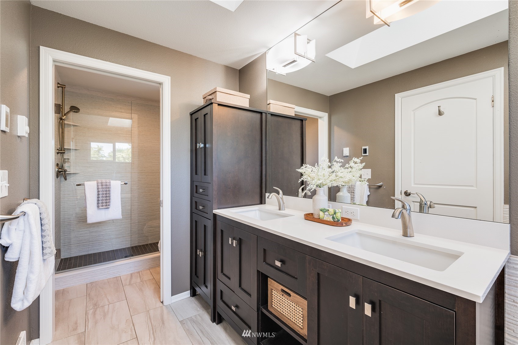 548 North 75th Street Seattle, WA 98103 - Photo 9 of 39 a bathroom with a sink and a mirror