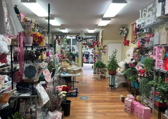 a store room with lots of flowers and fruits