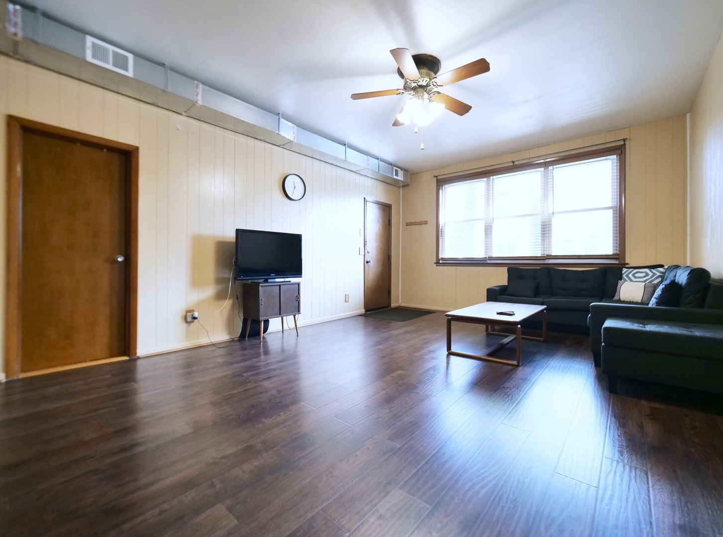 4556 South Justine Street Chicago, IL 60609 - Photo 11 of 50 a living room with furniture and a flat screen tv