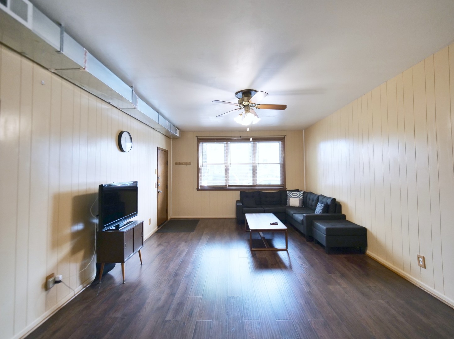 4556 South Justine Street Chicago, IL 60609 - Photo 13 of 50 a living room with furniture and a flat screen tv
