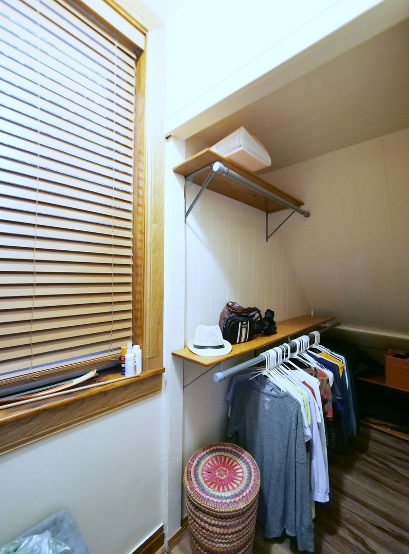 4556 South Justine Street Chicago, IL 60609 - Photo 14 of 50 a bedroom with a bed and a window