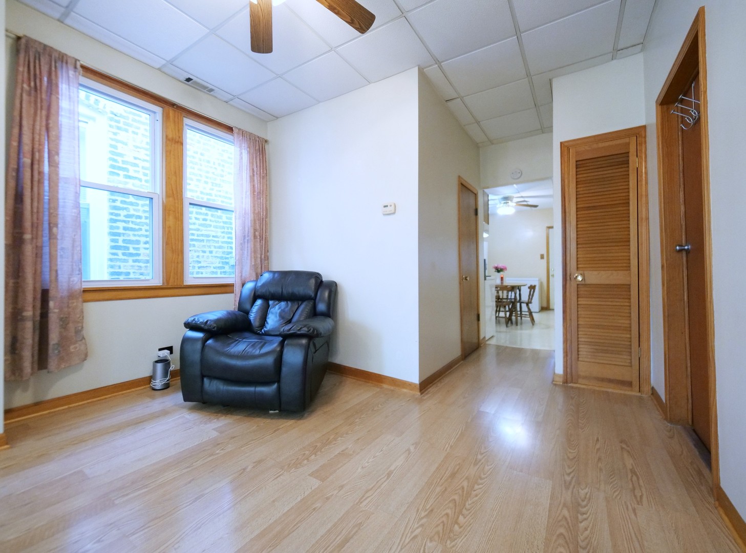 4556 South Justine Street Chicago, IL 60609 - Photo 29 of 50 a living room with furniture and a wooden floor
