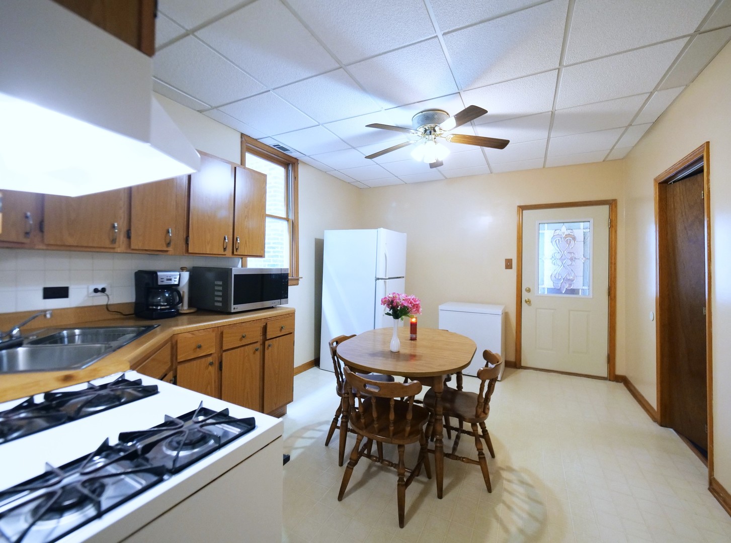 4556 South Justine Street Chicago, IL 60609 - Photo 35 of 50 a kitchen with a table and chairs in it