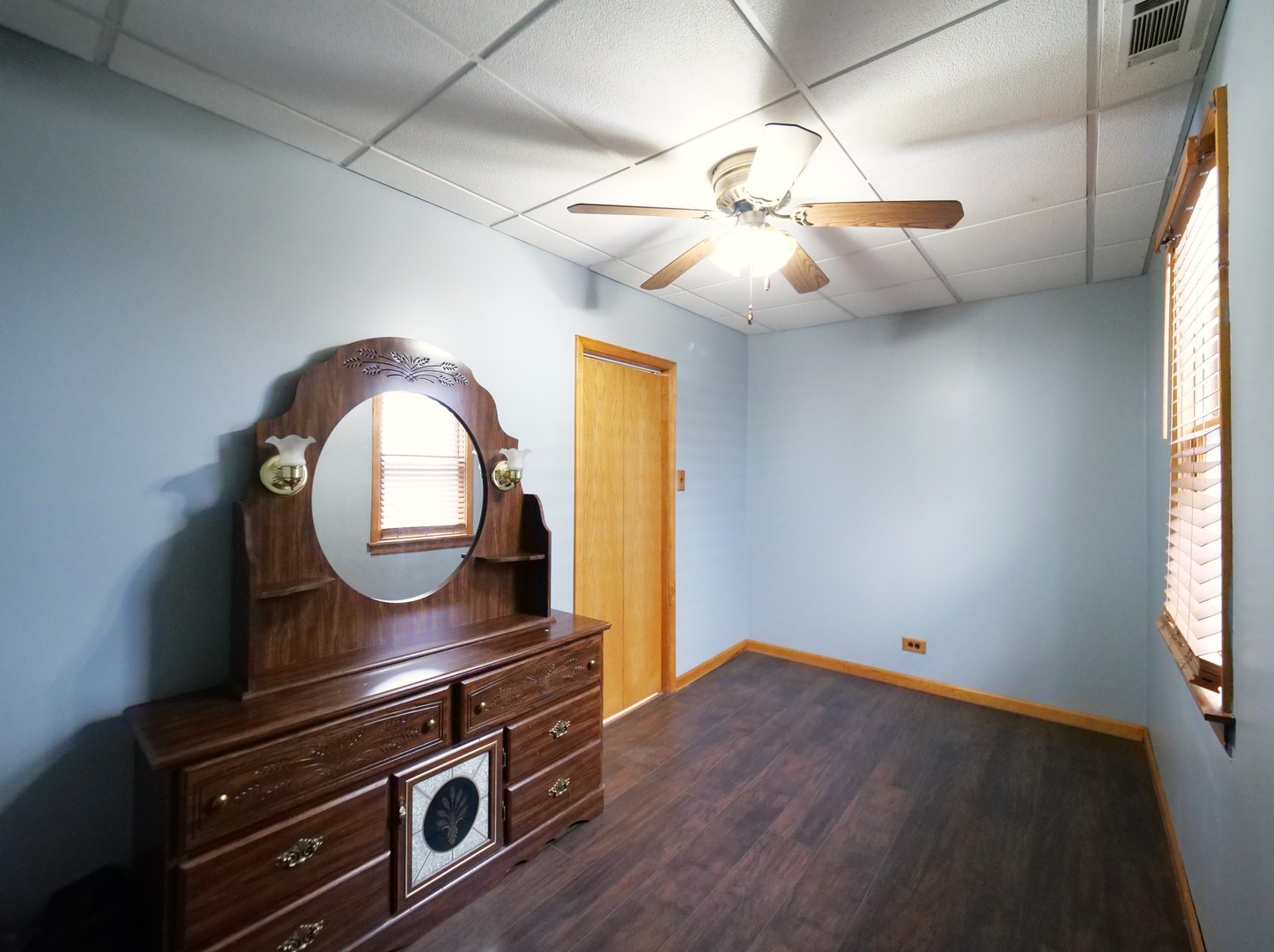 4556 South Justine Street Chicago, IL 60609 - Photo 40 of 50 a room with wooden floor fan and window