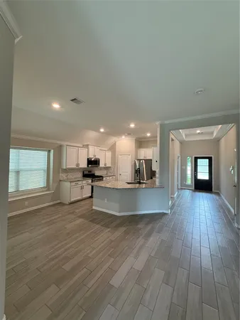 a view of kitchen with sink and cabinets