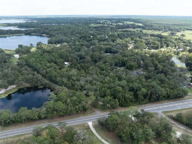 a view of a outdoor space with mountain view and trees