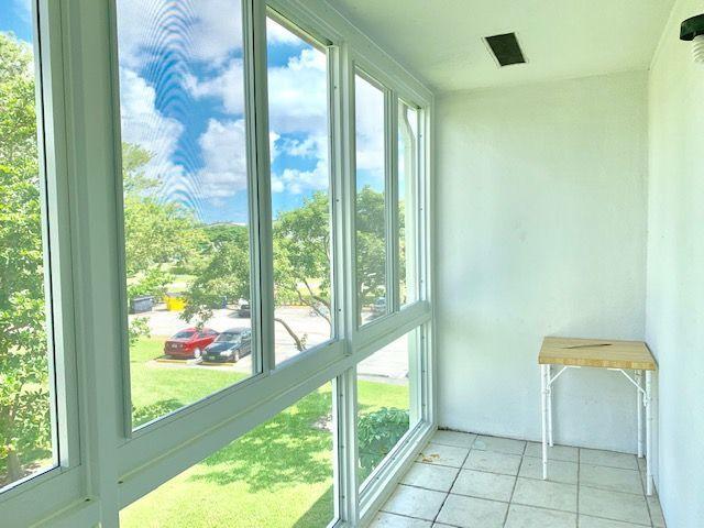250 Dorset F, Unit 250 Boca Raton, FL 33434 - Photo 13 of 24 Enclosed IMPACT Sliding Windows Patio