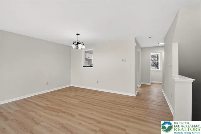 a kitchen with cabinets a refrigerator and a stove