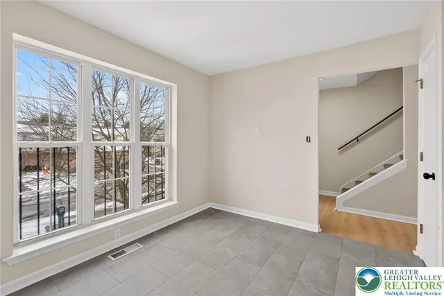a bathroom with a sink and a window