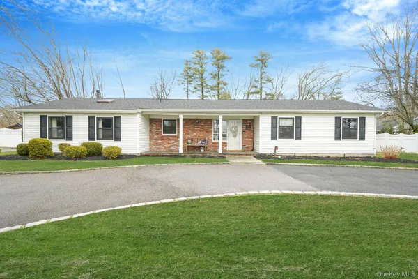 front view of a house next to a yard