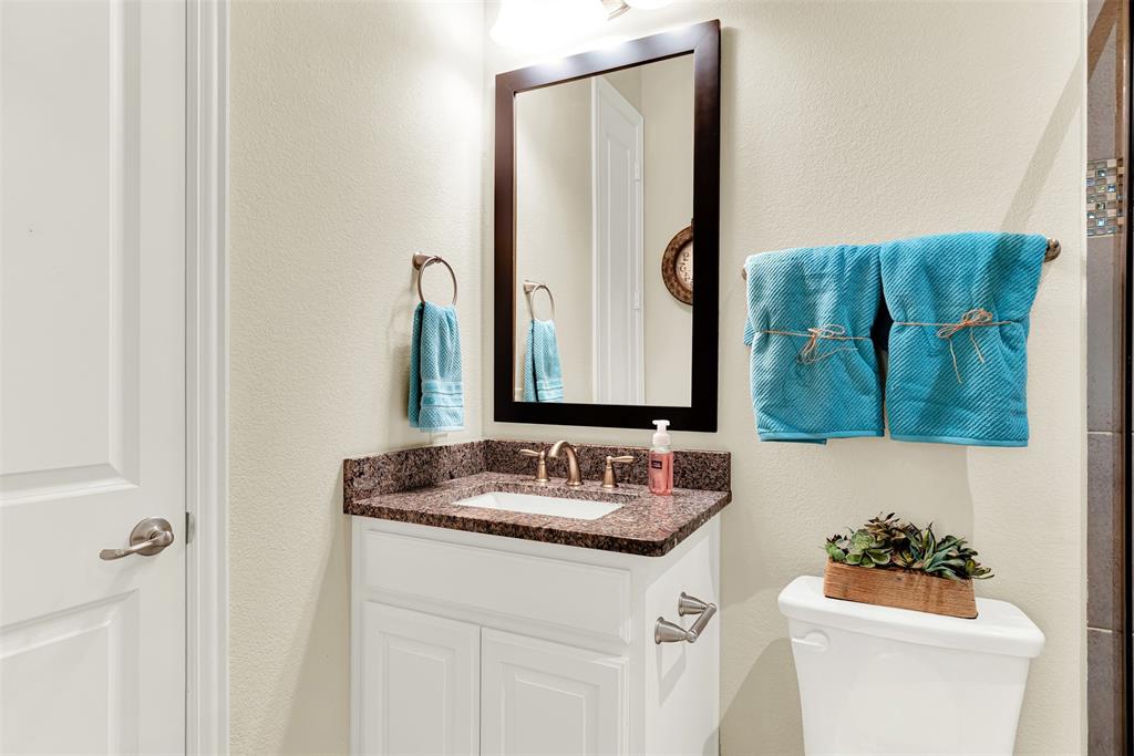 2804 Seabiscuit Road Celina, TX 75009 - Photo 16 of 40 a bathroom with a sink and a mirror