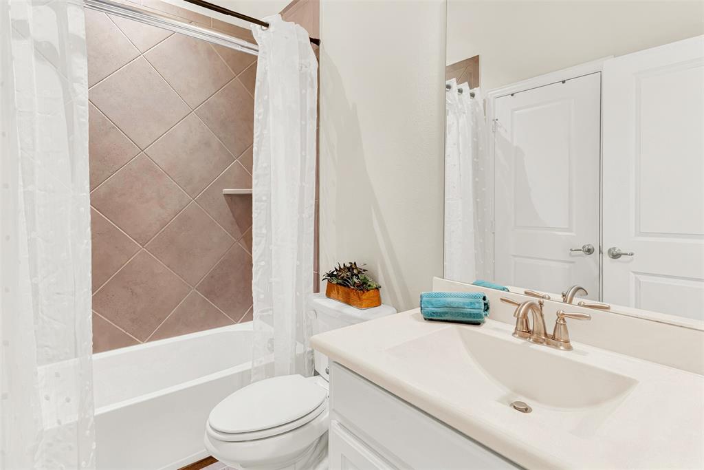 2804 Seabiscuit Road Celina, TX 75009 - Photo 28 of 40 a bathroom with a sink toilet and shower