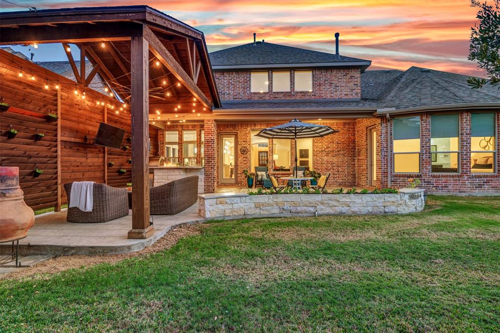 2804 Seabiscuit Road Celina, TX 75009 - Photo 37 of 40 a view of a house with a yard porch and sitting area