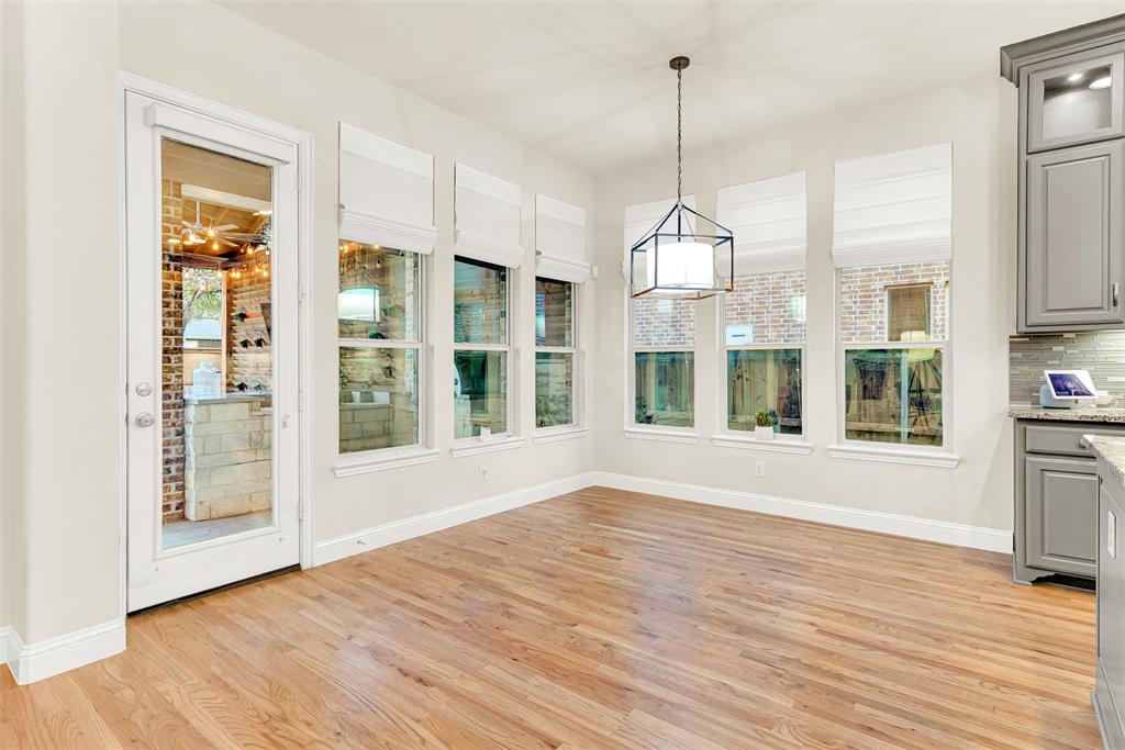 2804 Seabiscuit Road Celina, TX 75009 - Photo 9 of 40 a view of a room with wooden floor and windows