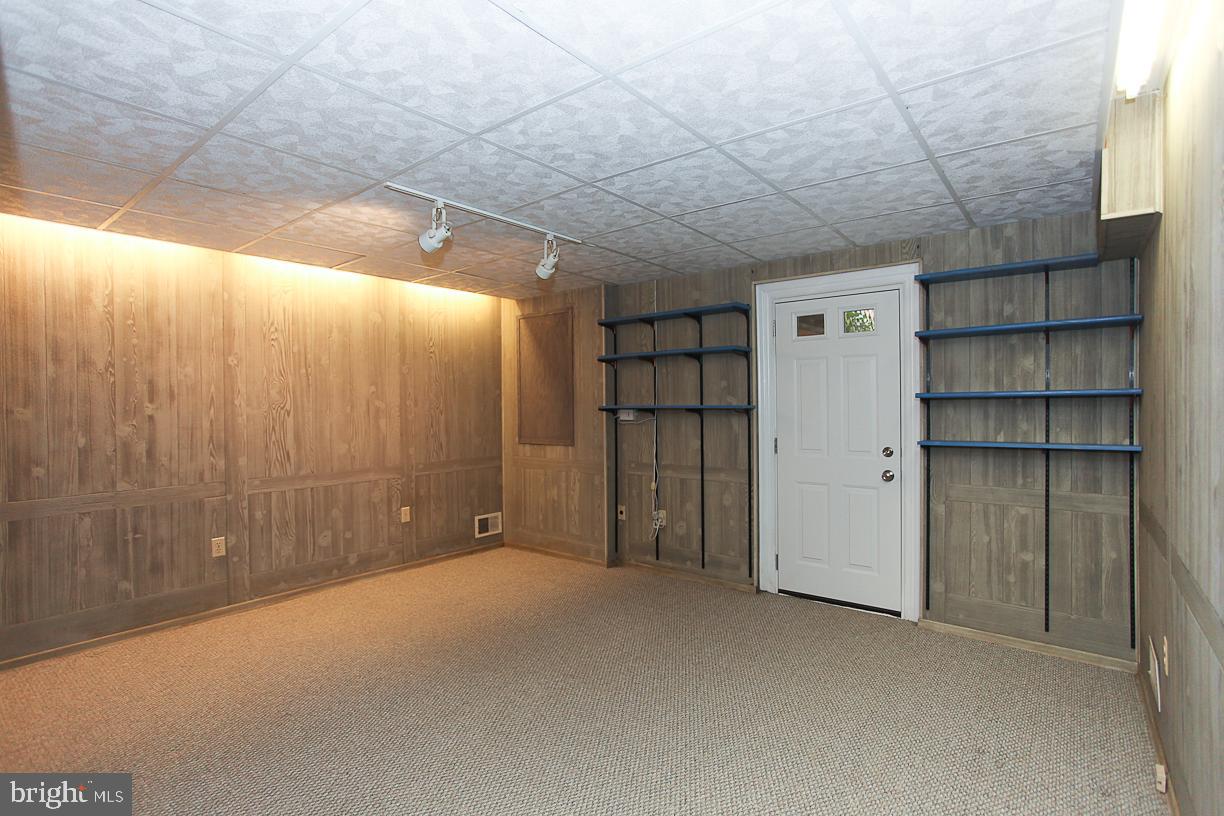 1606 Crestline Road Silver Spring, MD 20904 - Photo 42 of 56 Office Area with Shelving and Outside Exit