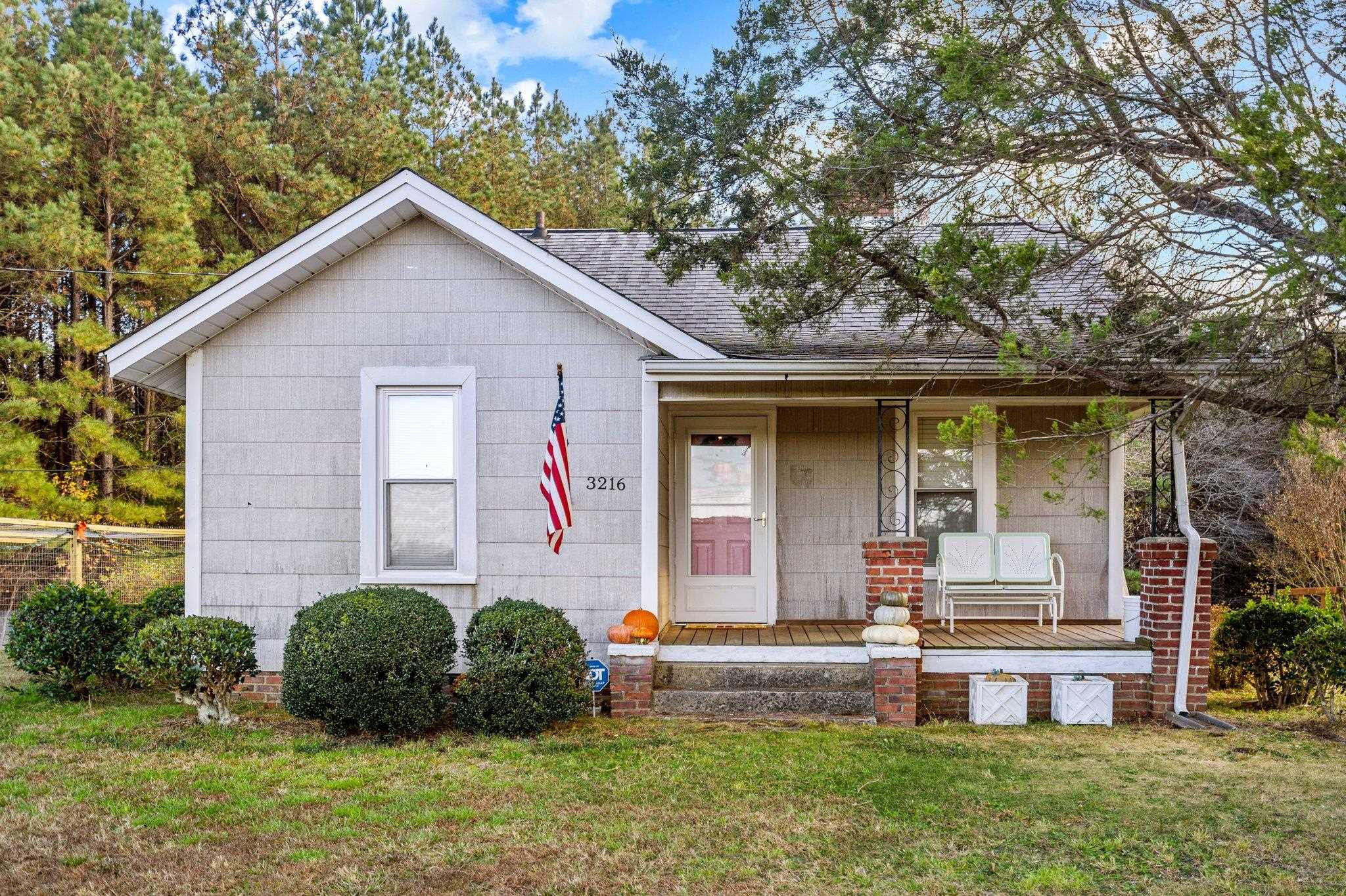 3216 Hamlin Road Durham, NC 27704 - Photo 11 of 14 a front view of a house with garden