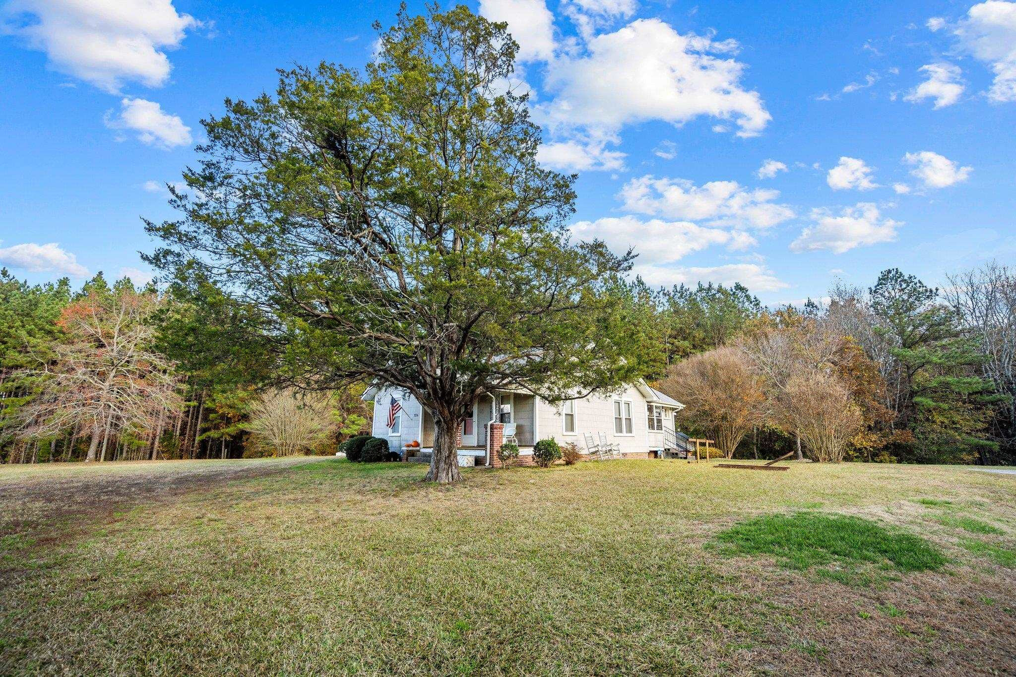 3216 Hamlin Road Durham, NC 27704 - Photo 14 of 14 a view of a tree in front of a house