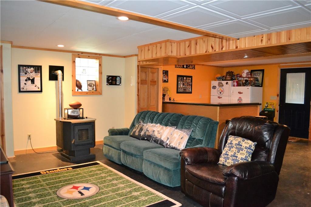 119 Pine Tree Road Kittanning, PA 16201 - Photo 18 of 25 The finished basement has tons of custom character and a pellet stove to keep it cozy!