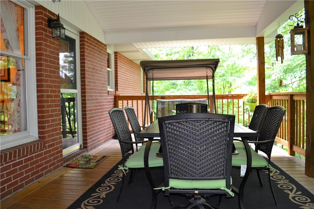 119 Pine Tree Road Kittanning, PA 16201 - Photo 22 of 25 The covered rear deck provides a great place to sit and enjoy the back yard