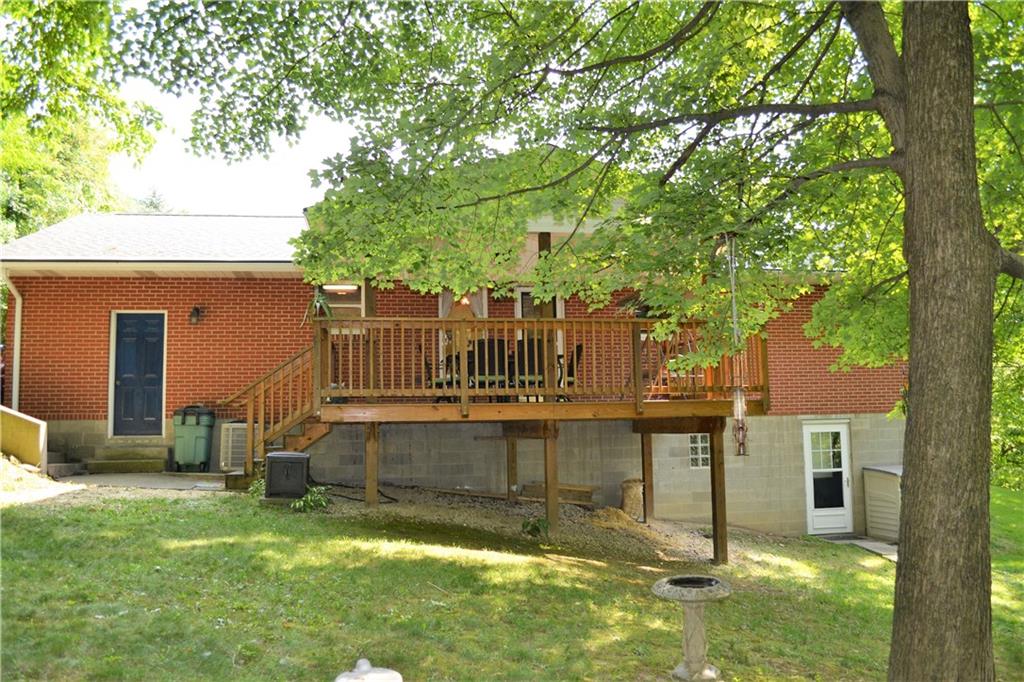 119 Pine Tree Road Kittanning, PA 16201 - Photo 24 of 25 The back of the house with the covered rear deck, walk out basement, and garage access