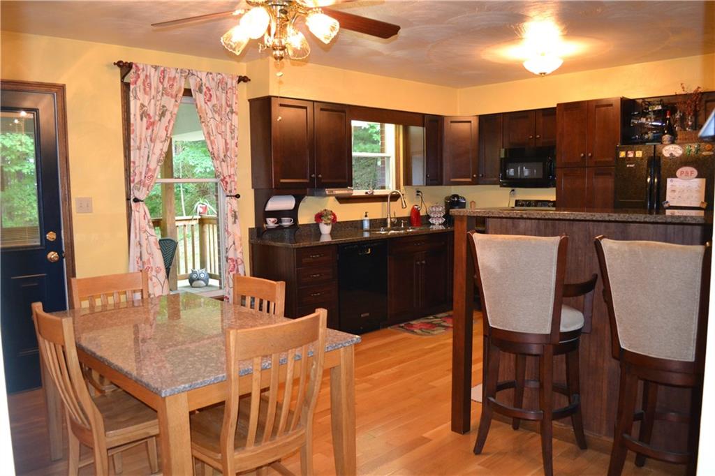 119 Pine Tree Road Kittanning, PA 16201 - Photo 10 of 25 The gorgeous eat in kitchen features cherry cabinets, granite countertops, and hard wood floors.