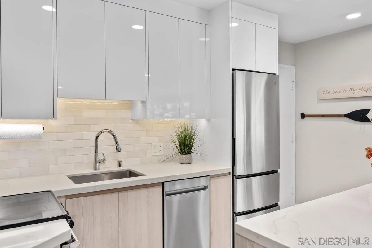 8040 Girard Avenue, Unit 2 La Jolla, CA 92037 - Photo 15 of 27 a kitchen with a refrigerator and a sink