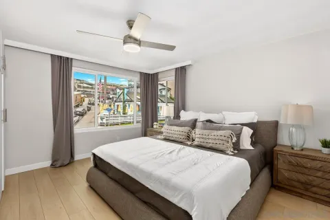 a bedroom with bed and window