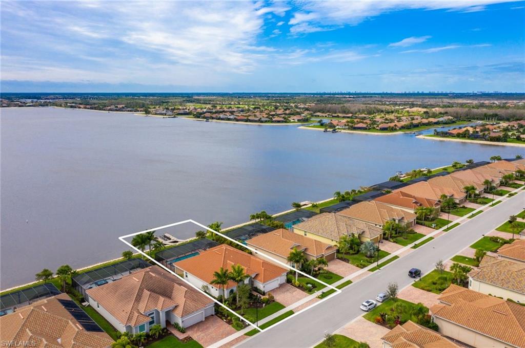 9293 Quarry Drive Naples, FL 34120 - Photo 1 of 28 an aerial view of a city