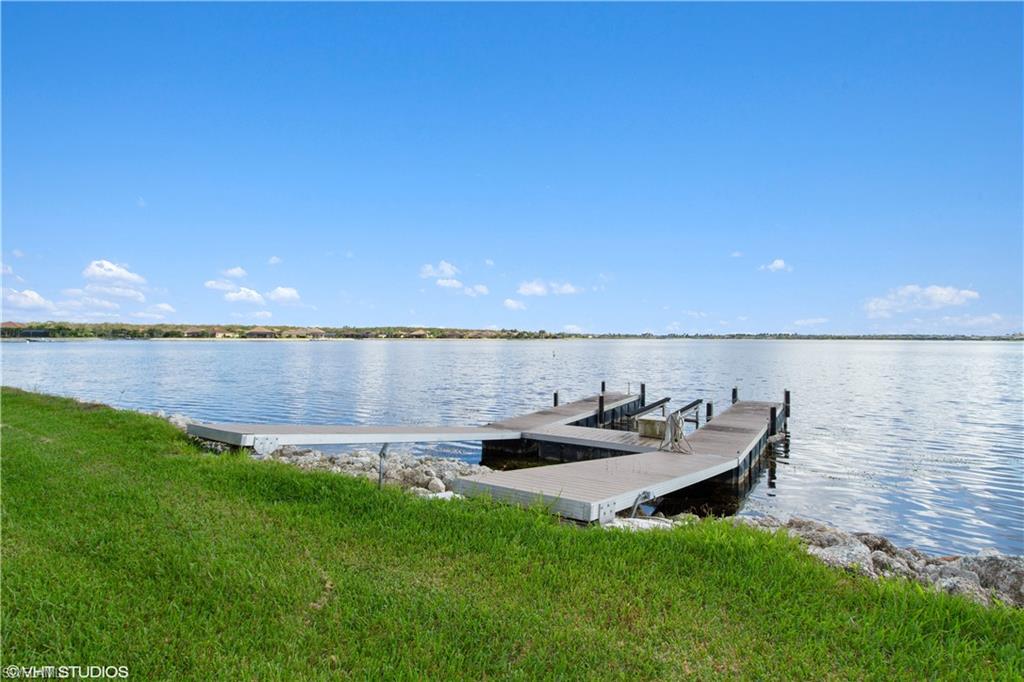 9293 Quarry Drive Naples, FL 34120 - Photo 17 of 28 a view of a lake with couches near an ocean