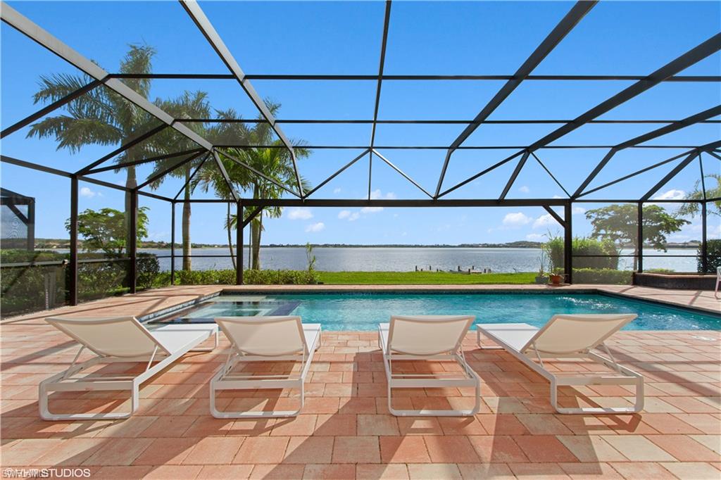 9293 Quarry Drive Naples, FL 34120 - Photo 18 of 28 a view of swimming pool with a yard