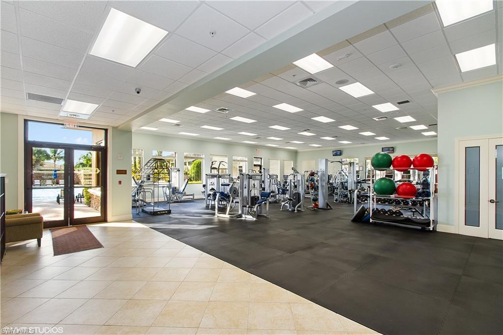 9293 Quarry Drive Naples, FL 34120 - Photo 24 of 28 a view of a garage with a bike