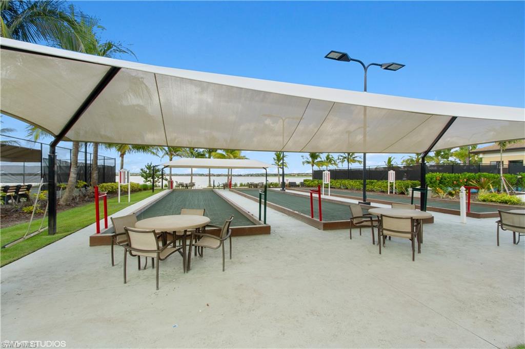 9293 Quarry Drive Naples, FL 34120 - Photo 25 of 28 a view of an outdoor space with seating area