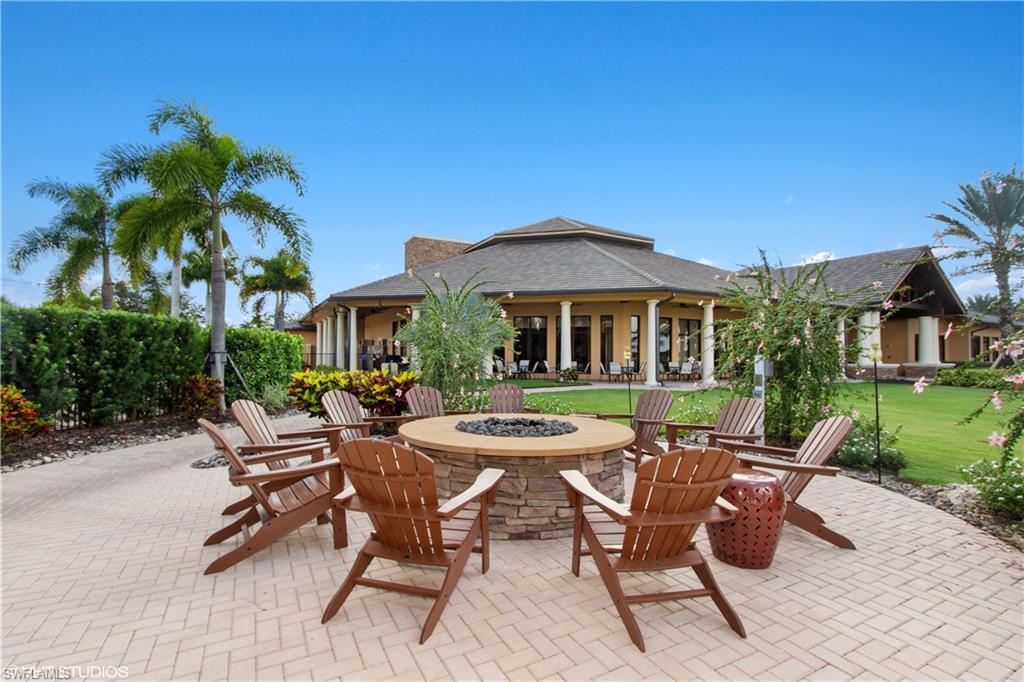 9293 Quarry Drive Naples, FL 34120 - Photo 26 of 28 a view of a house with backyard sitting area and garden