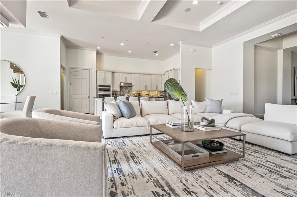 9293 Quarry Drive Naples, FL 34120 - Photo 3 of 28 a living room with furniture and wooden floor