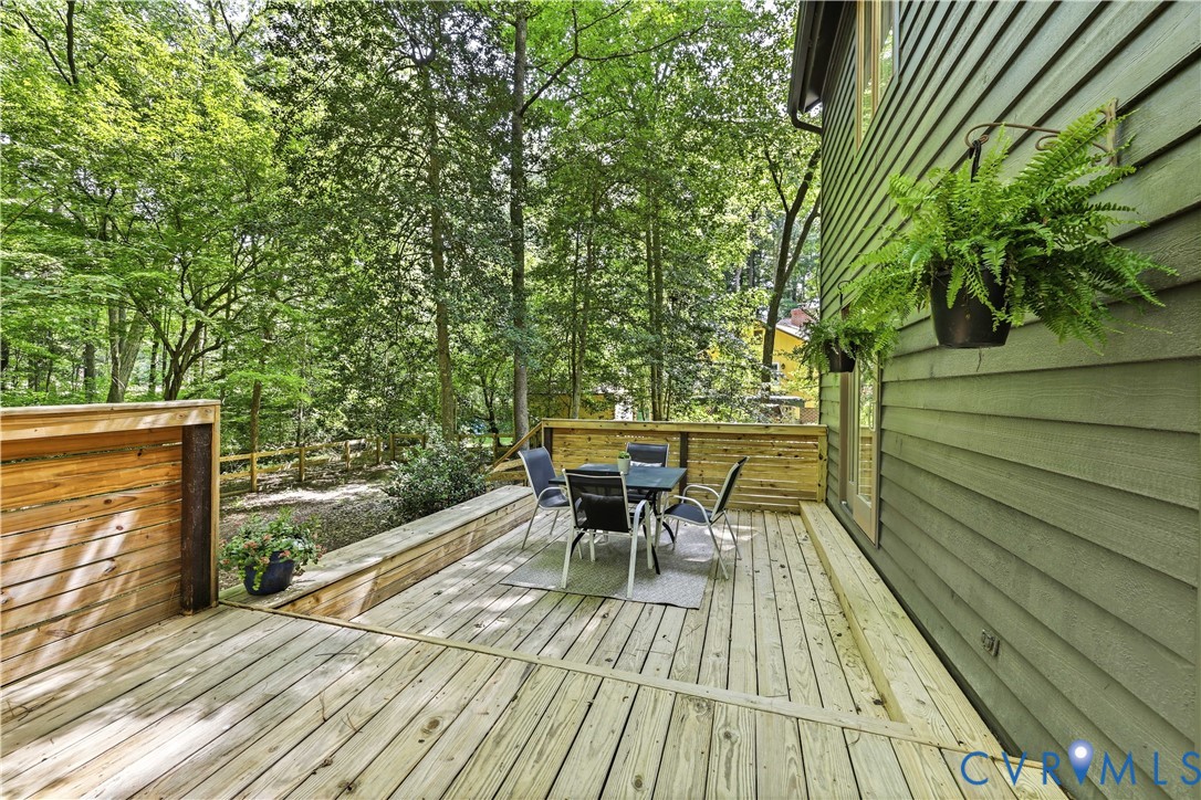 13622 Winterberry Ridge Midlothian, VA 23112 - Photo 29 of 47 a view of a chairs and table on the wooden deck