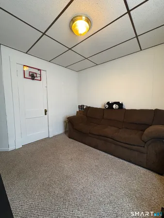 a bedroom with a bed and a lamp