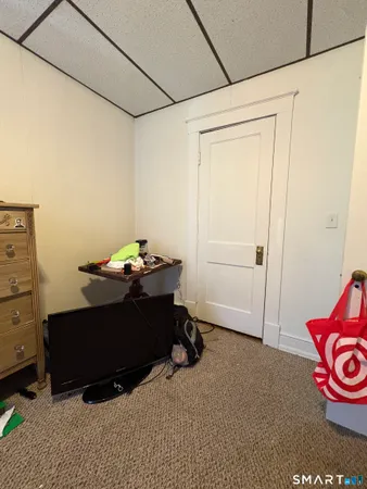 a room with a table and a closet