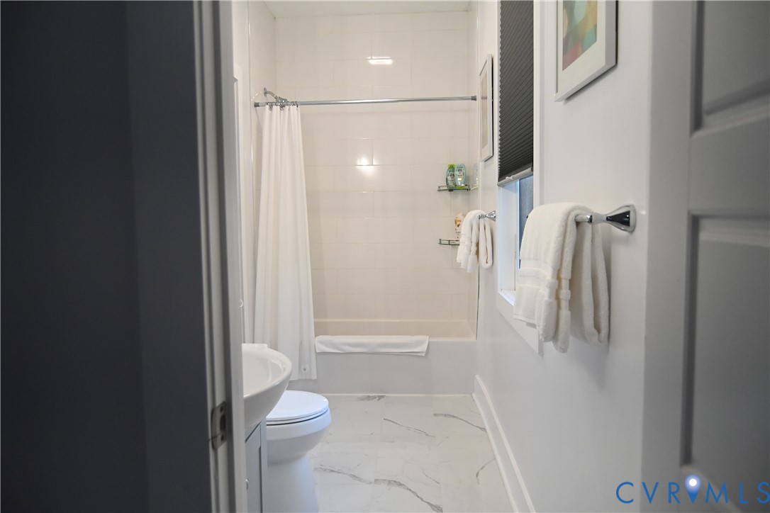 2721 Terminal Avenue Richmond, VA 23234 - Photo 15 of 30 a bathroom with a shower and a toilet