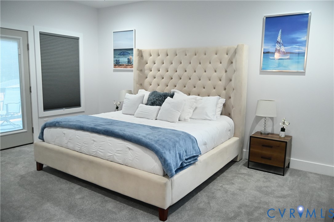 2721 Terminal Avenue Richmond, VA 23234 - Photo 19 of 30 a bedroom with bed and a night stand