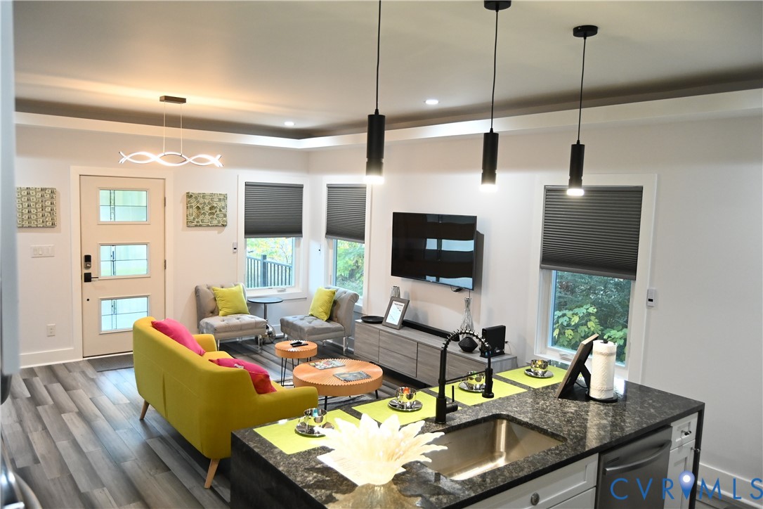 2721 Terminal Avenue Richmond, VA 23234 - Photo 2 of 30 a living room with furniture a flat screen tv and a large window