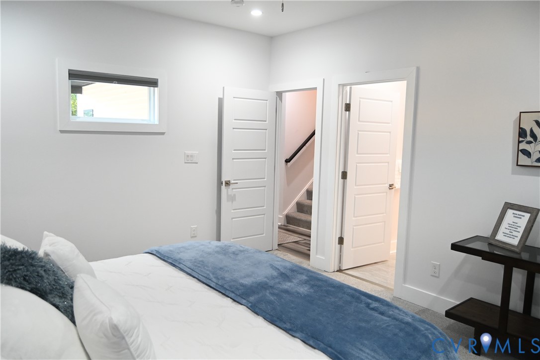 2721 Terminal Avenue Richmond, VA 23234 - Photo 22 of 30 a bedroom with a bed and a chair in it