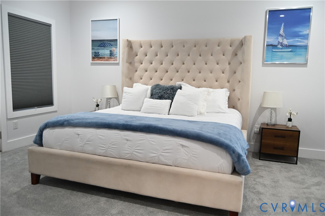 2721 Terminal Avenue Richmond, VA 23234 - Photo 23 of 30 a bedroom with a bed and a couch