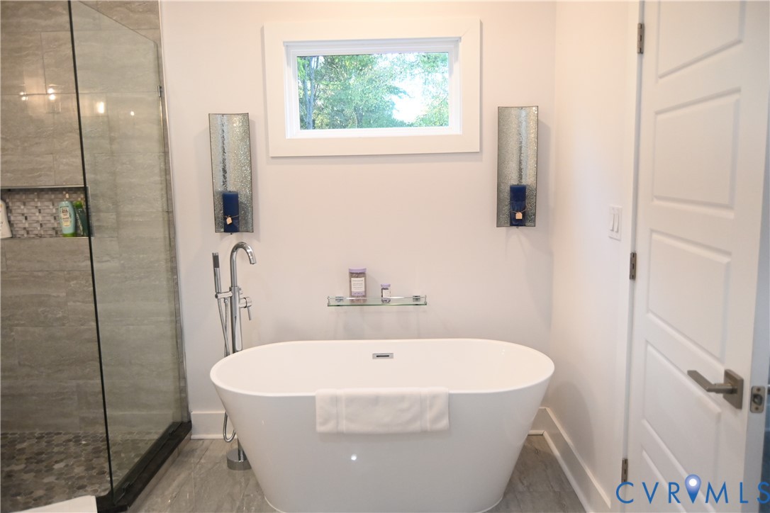 2721 Terminal Avenue Richmond, VA 23234 - Photo 26 of 30 a white bath tub sitting next to a white sink