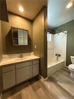 a bathroom with a bathtub and a sink