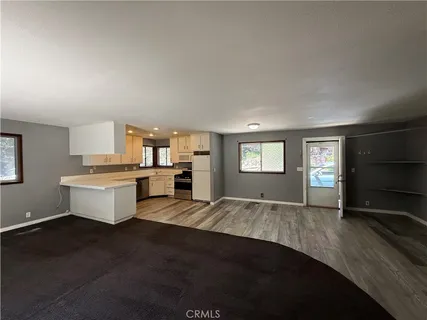 a view of living room with furniture and window