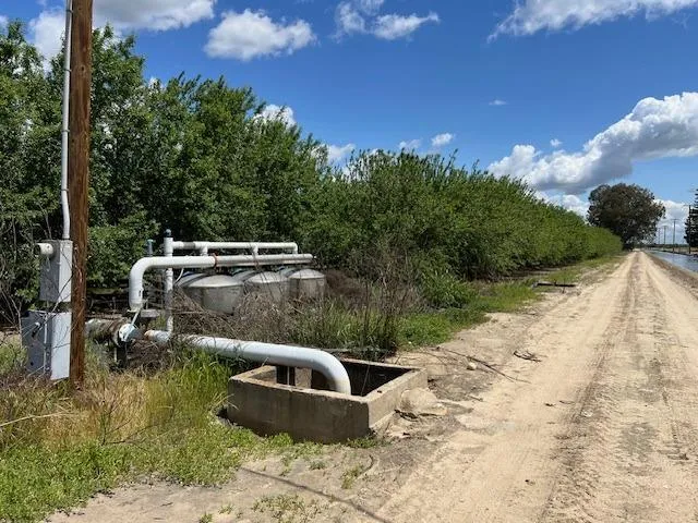 a view of a house with backyard sitting area and garden