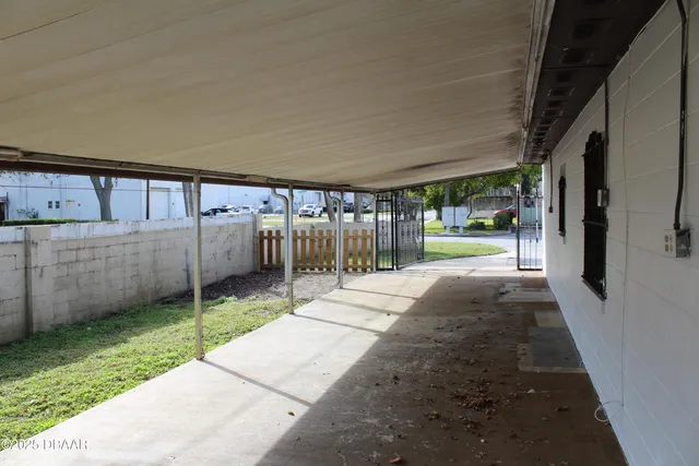 a view of a backyard with under large trees